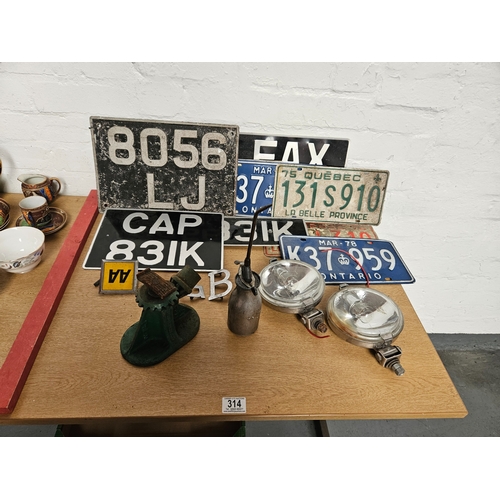 314 - Vintage number plates to include Canada, vintage car spotlights, car jack and oil can