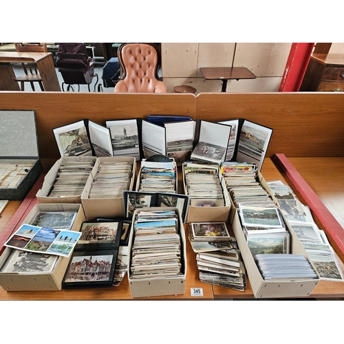 345 - A large quantity of postcards