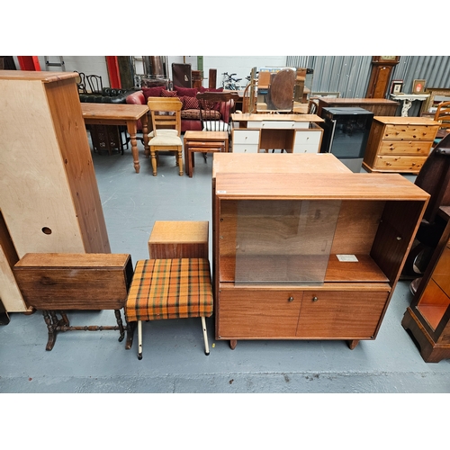 402 - A teak glass fronted bookcase together with a Sutherland table and a retro footstool