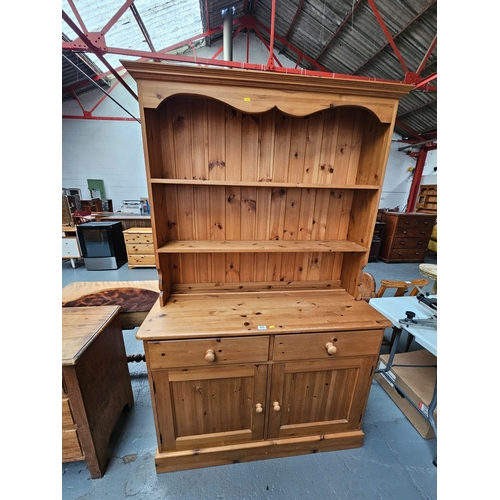 405 - A pine dresser - top not attached to base

Dimensions: Height 196cm, Width 122cm, Depth 48cm