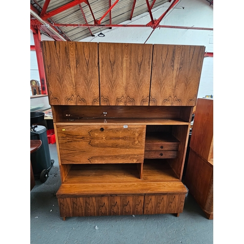 414 - A three sectioned wall unit, believed to be Danish

Height 188cm, Width 128cm, Depth 60cm