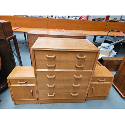 419 - An oak G Plan chest of drawers together with a pair of matching oak G Plan bedside cabinets