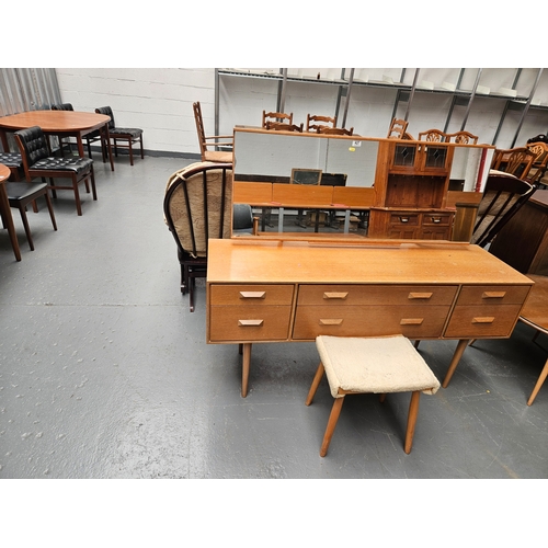 427 - A Stag teak dressing table with stool

Dimensions: Height 124cm, Width 150cm, Depth 44cm