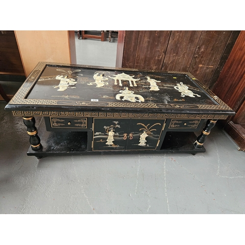 430 - A Chinoiserie coffee table with under cupboards

Dimensions: Height 45cm, Width 122cm, Depth 63cm