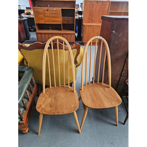 445 - A pair of blonde Ercol dining chairs