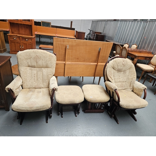 459 - A pair of upholstered seated Dutailier rocking/gliding chairs with matching footstools