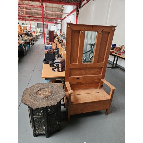 462 - A pine hallstand with seating together with a mother of pearl inlaid tourist fold out table