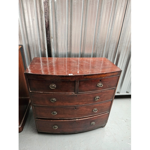 465 - A mahogany bow fronted two over three chest of drawers

Height 96cm, Width 102cm, Depth 52cm