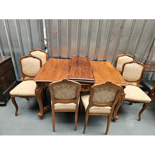 466 - An extending dining table with 3 extra leaves and 6 chairs