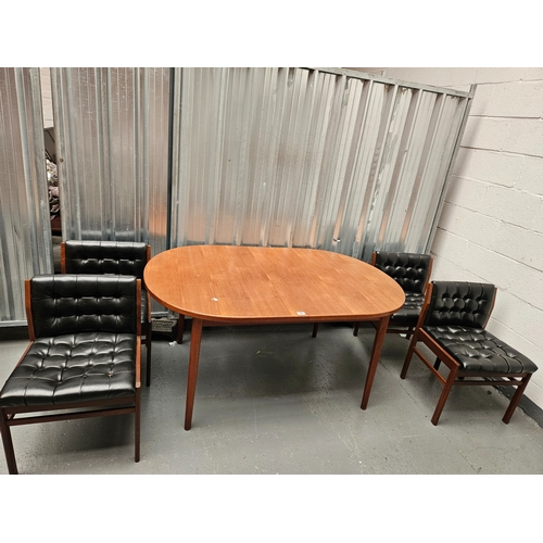 468 - An oval teak extending dining table with 4 chairs