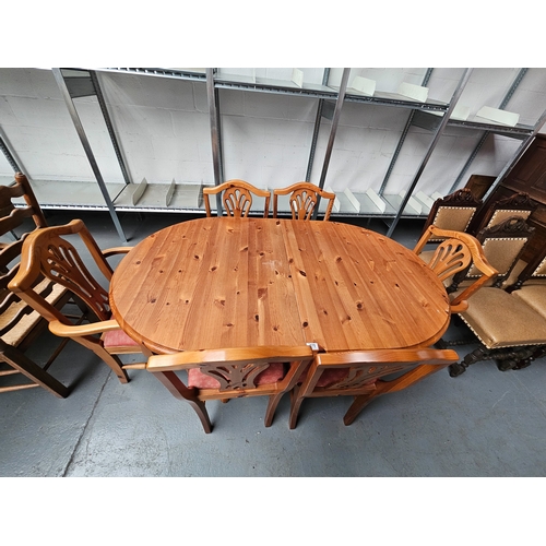 470 - A pine extending dining table to include 6 chairs 2 of which are carvers