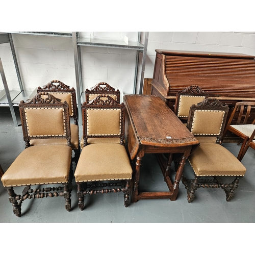 471 - An oak drop leaf dining table with 6 chairs