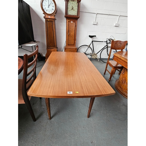 481 - A teak draw leaf extending dining table