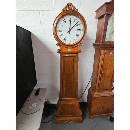 486 - A modern grandfather clock with circular dial and quartz movement