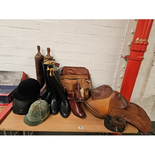 309 - Quantity of horse riding equipment including a leather saddle, riding hats, satchels, riding boots, ... 