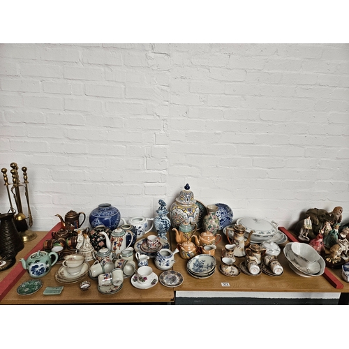 313 - A collection of assorted Oriental style china to include ginger jars, tea services, plates, etc