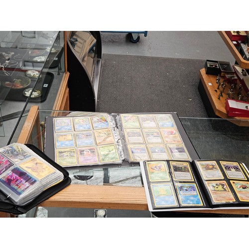 548 - Pokemon cards, tins, figure and videos