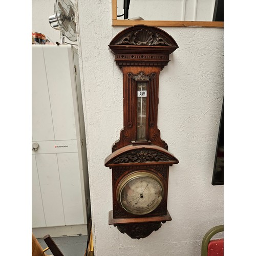 550 - A carved wall hanging barometer untested