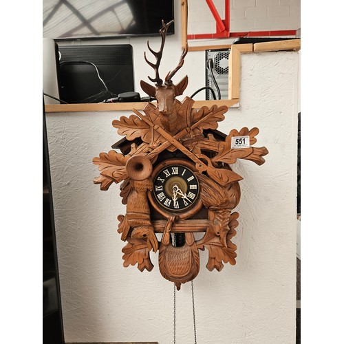 551 - A large twin weight cuckoo clock