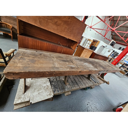 380 - A large wooden topped workbench with cast iron legs stamped with the Crown and E.R. (dollies not inc... 