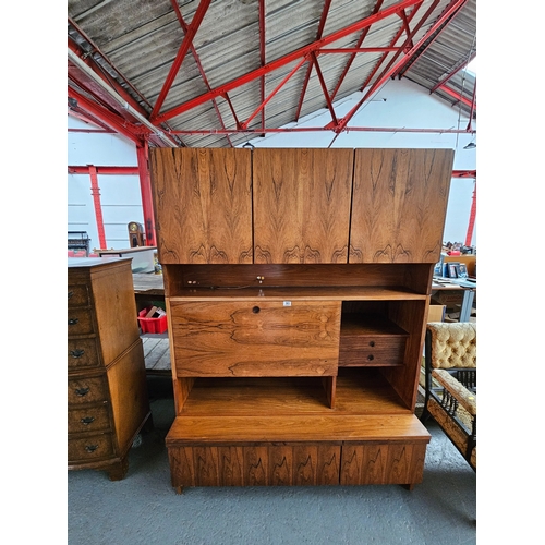 383 - A three sectioned wall unit, believed to be Danish

Height 188cm, Width 128cm, Depth 60cm