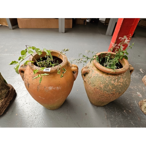 390 - A pair of terracotta urn style garden planters

Height 54cm each