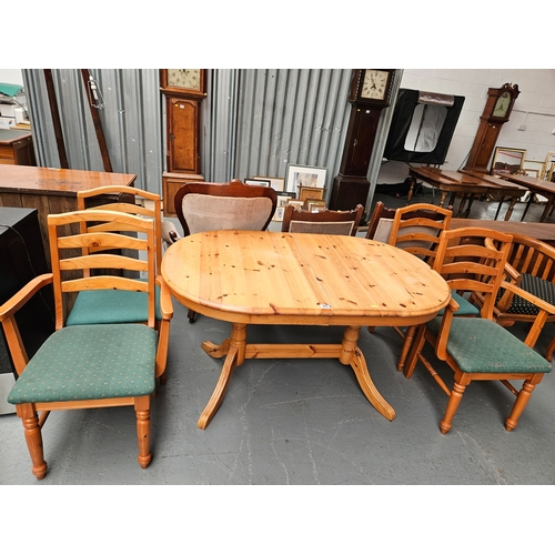 408 - A pine extending dining table with 4 chairs to include 2 carvers