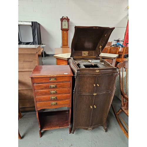 410 - A sheet music cabinet together with an oak gramophone cabinet on castors (missing 1 castor)