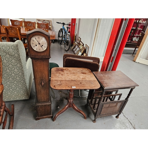 412 - An oak cased granddaughter clock, a tilt top table on tripod base and a magazine table rack