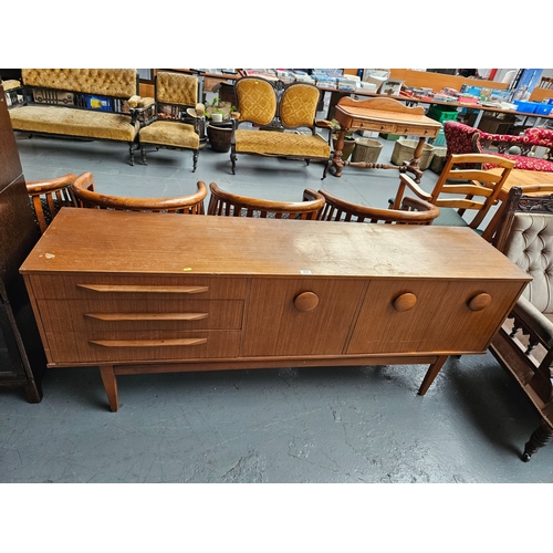 417 - A teak retro sideboard

Measurements: Depth 44cm, Height 74cm, Width 182cm