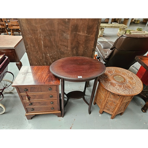 422 - A small mahogany chest of drawers, side table and a carved tourist table