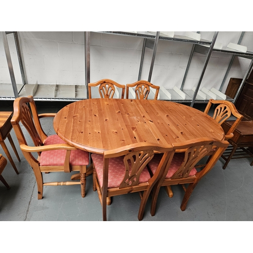 439 - A pine extending dining table to include 6 chairs 2 of which are carvers