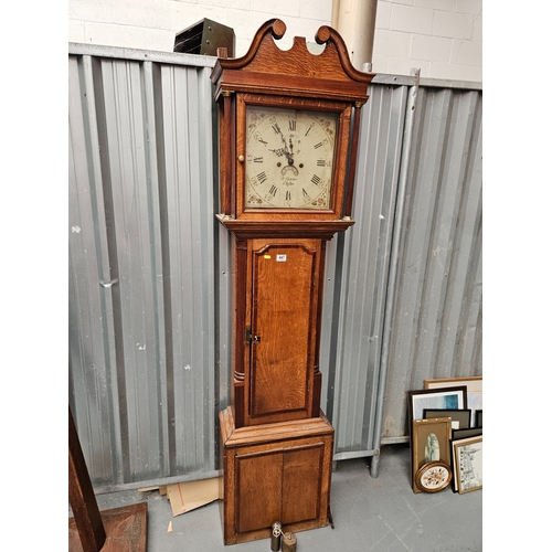 447 - An oak cased 8 day grandfather clock