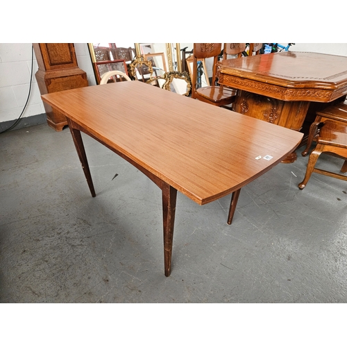 451 - A teak draw leaf extending dining table