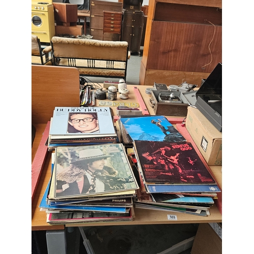 569 - A quantity of vinyl LPs - Bob Dylan, Depeche Mode, Buddy Holly, etc