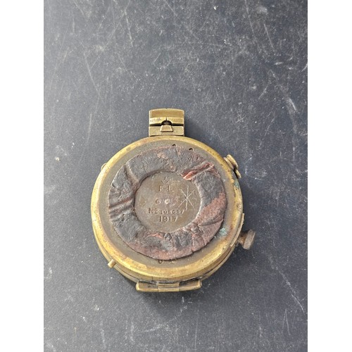 816 - An early brass compass - dated 1917 - believed to be military - not working