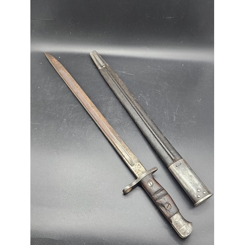 831 - A 1917 American issue Remington bayonet and scabbard - fair condition