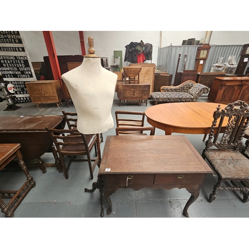 597 - An oak lowboy together with a seamstress mannequin on stand