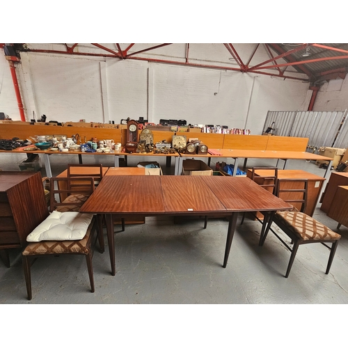 616 - A Richard Hornby extending dining table with one extra leaf and four chairs