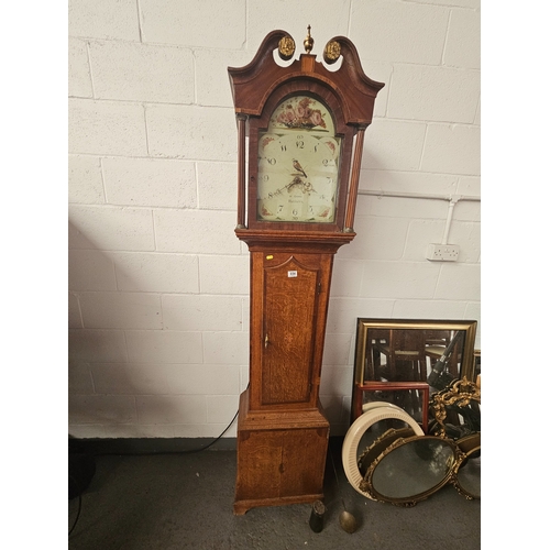 654 - An oak cased 30 hour grandfather clock