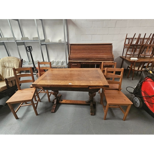 662 - An oak draw leaf extending table with 4 pine chairs