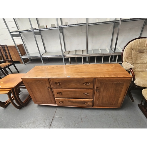 664 - An Ercol sideboard on castors

Measurements: Height 70cm, Width 155cm, Depth 45cm