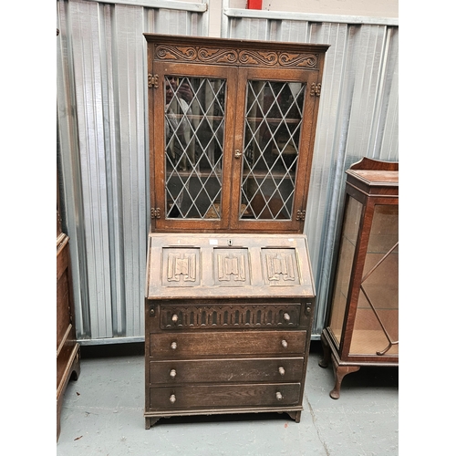 668 - An oak bureau bookcase

Measurements: Height 176cm, Width 77cm, Depth 44cm