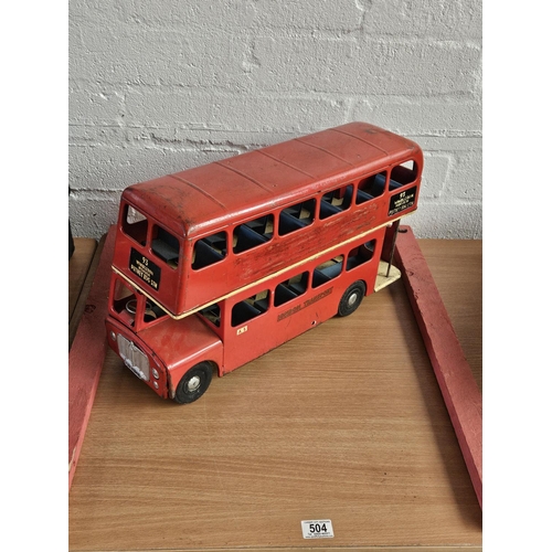 504 - A large tinplate London Transport double decker bus - approximately 56cm long