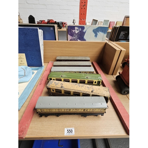 550 - Five early Hornby O gauge carriages - GWR, LMS, etc - in fair condition