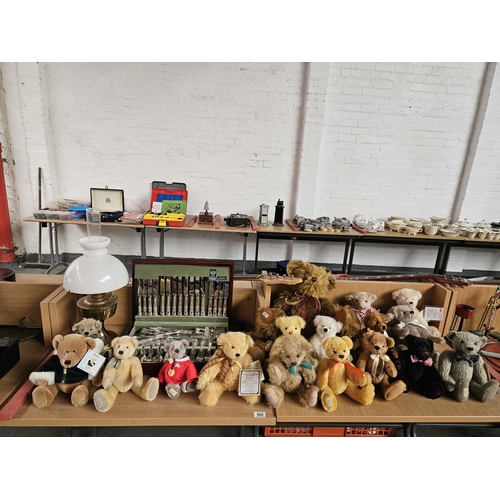 560 - A collection of teddy bears - many being Harrods, an oil lamp and a canteen of cutlery