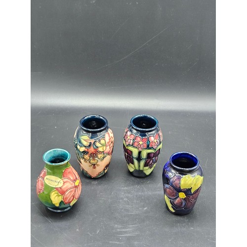 808 - Four small Moorcroft vases - Oberon Honeysuckle, Anemone and Violet patterns - average height is 4 i... 