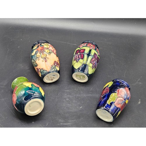 808 - Four small Moorcroft vases - Oberon Honeysuckle, Anemone and Violet patterns - average height is 4 i... 