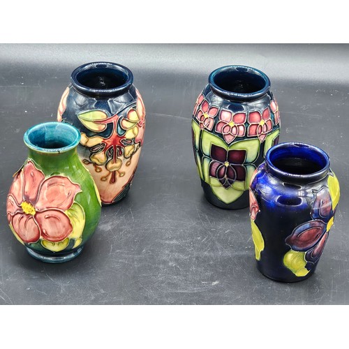 808 - Four small Moorcroft vases - Oberon Honeysuckle, Anemone and Violet patterns - average height is 4 i... 