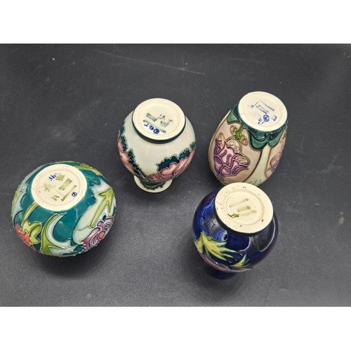 830 - Four small Moorcroft vases - Foxglove, Anemone, Trainee vase and Leicester patterns - average height... 